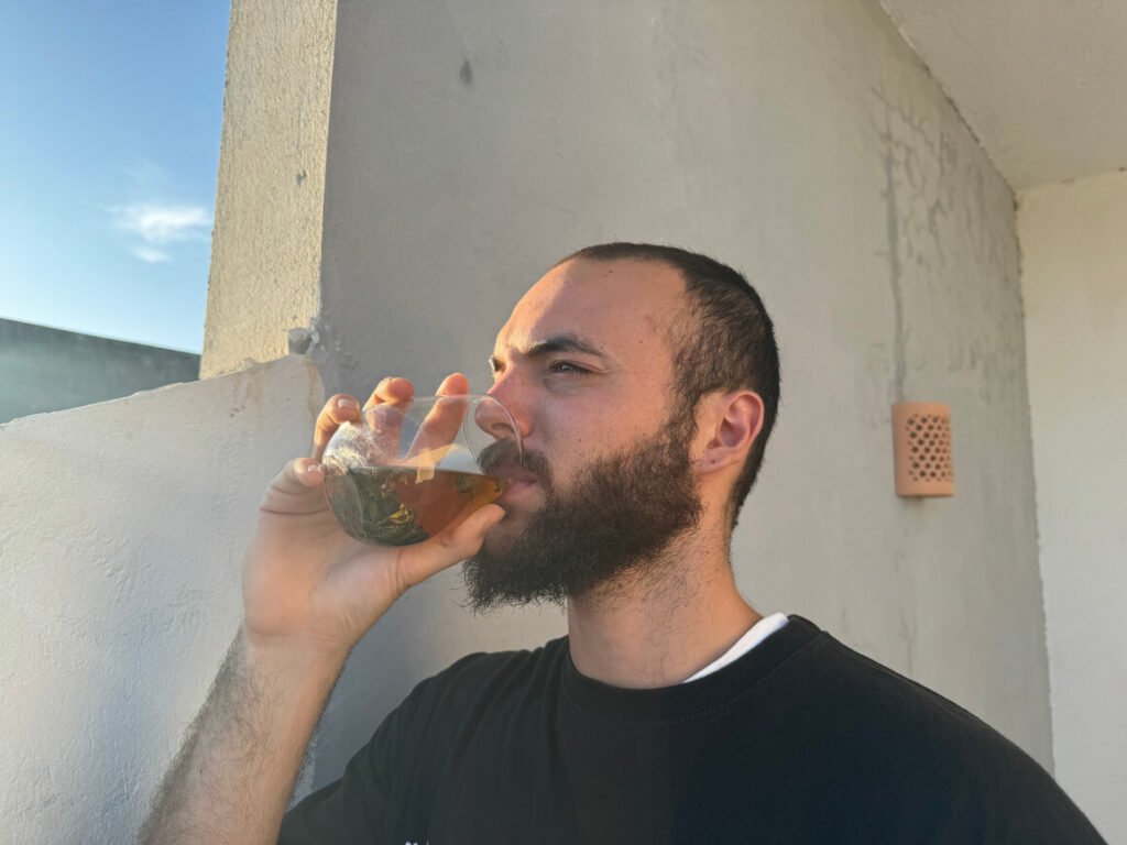 man drinking green tea